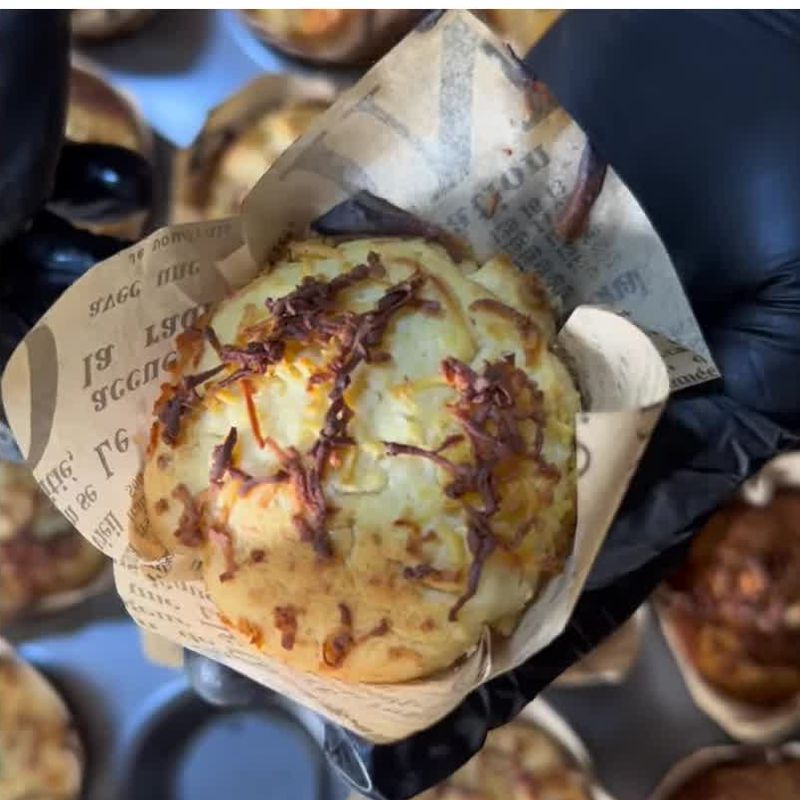 Cheese muffin in a paper wrap